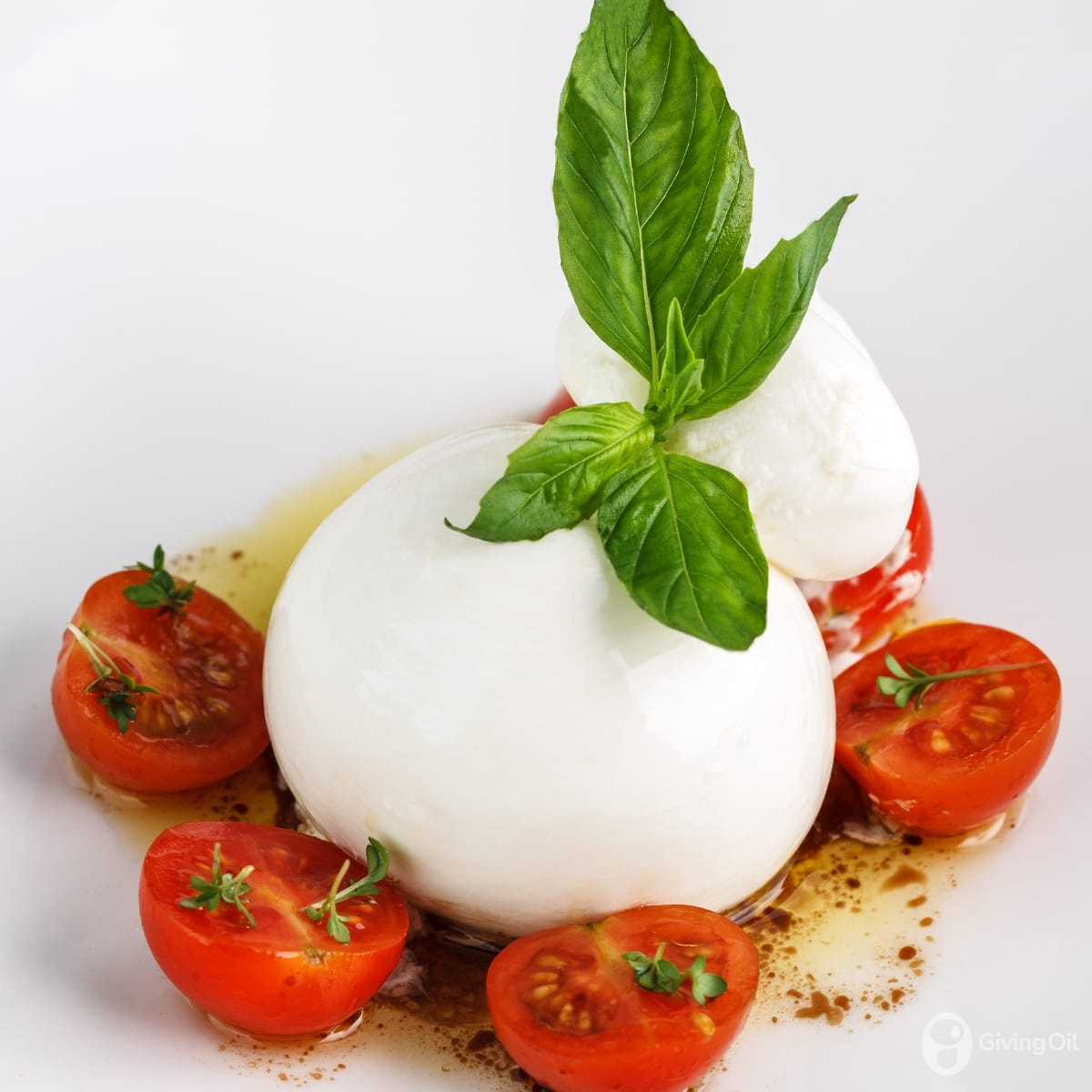 Burrata & heirloom tomatoes with extra virgin olive oil